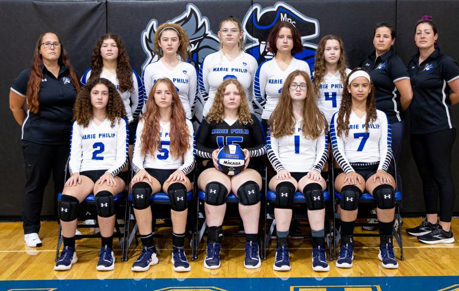 MPS Girls Volleyball Team photo. Two rows of athletes. Front row is sitting, back row is standing.