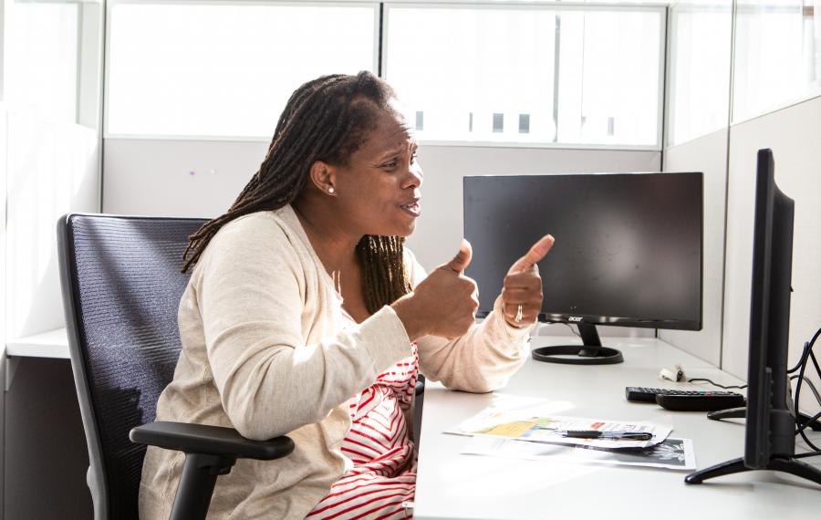 A lady talking to somebody on video phone 