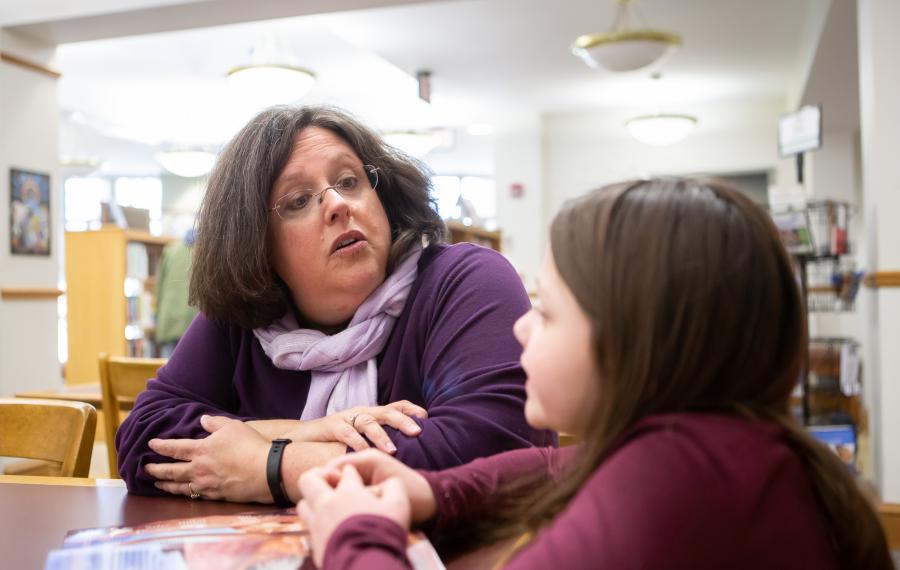 A teacher talking to a student. 