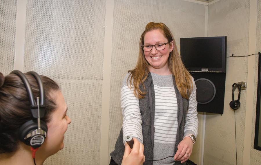 audiologist giving headphone