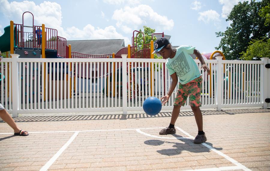 A Walden school student playing Four Square