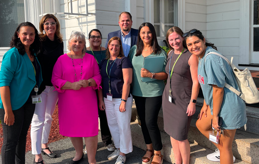 A group of TLC staff with members of the Commission on the Status of Persons with Disabilities