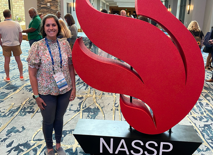 Jessica Greenfield standing next to the NASSP sign