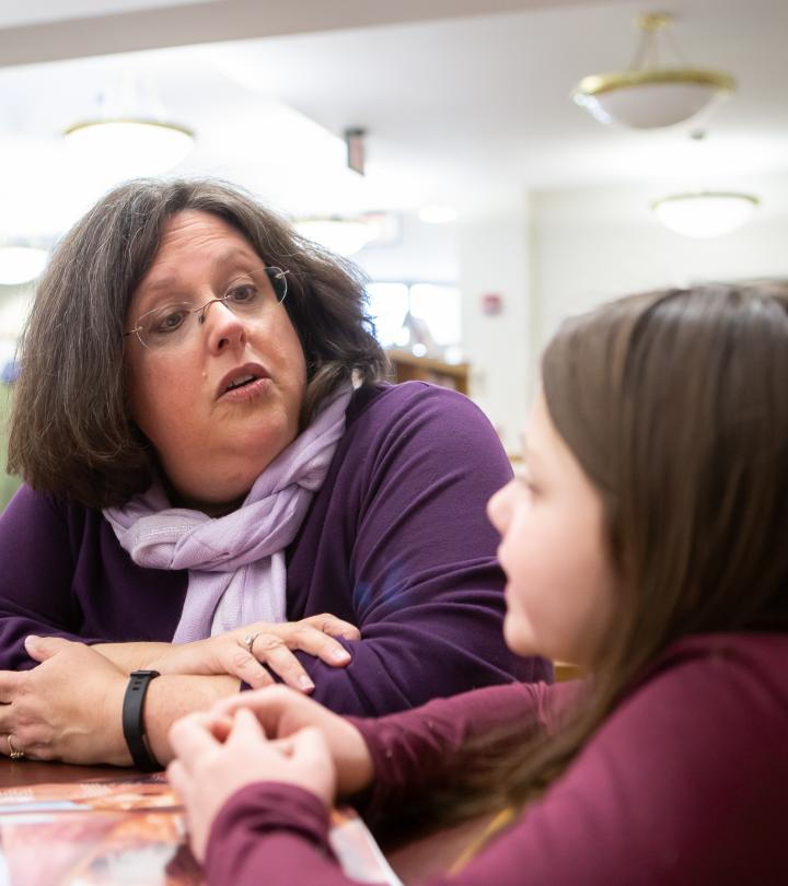 A teacher talking to a student. 