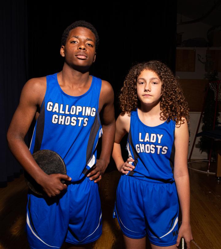 two track athletes posing