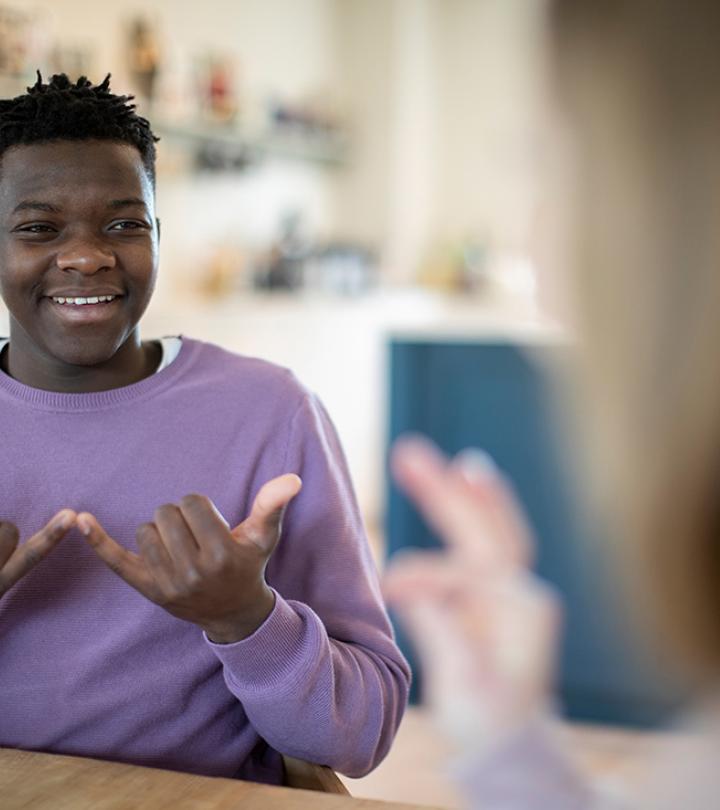 Photo of Black boy using Sign Language