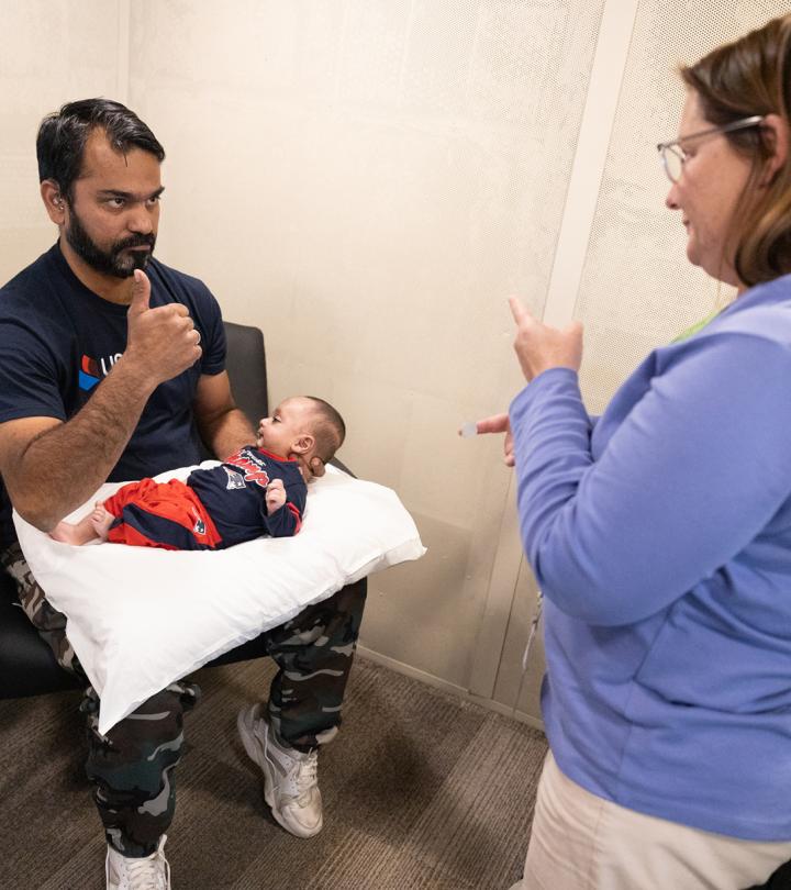 A baby receives a newborn hearing screening.