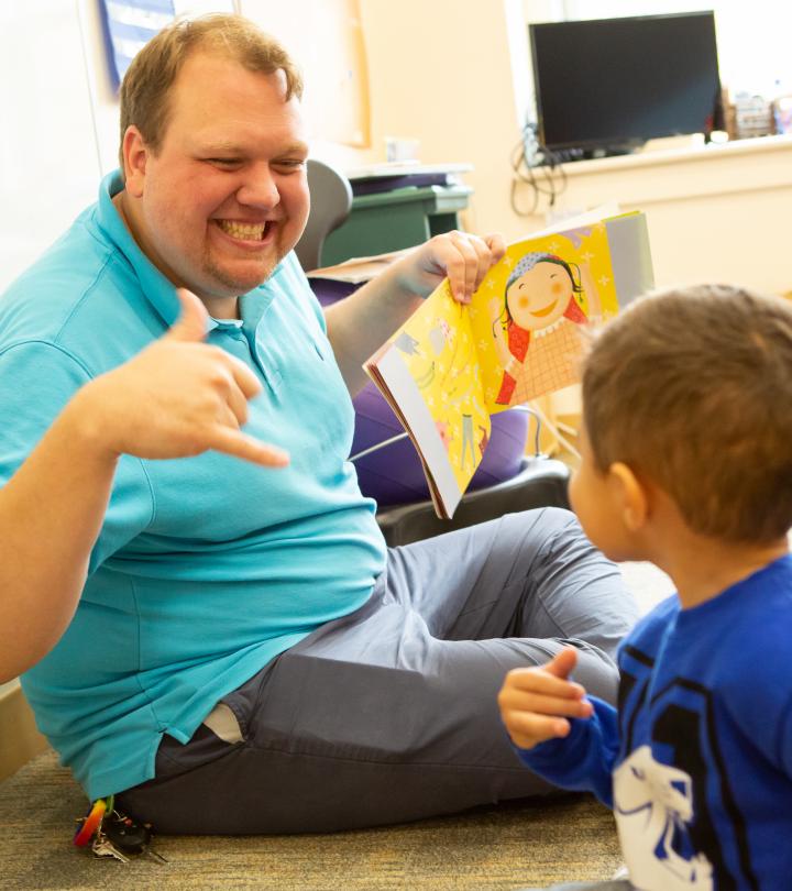A teacher teaching ASL to students