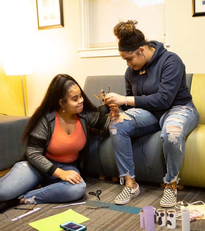 Two students doing artwork. 