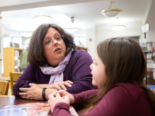 Teacher talking to a student