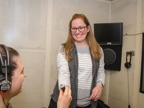 audiologist giving headphone