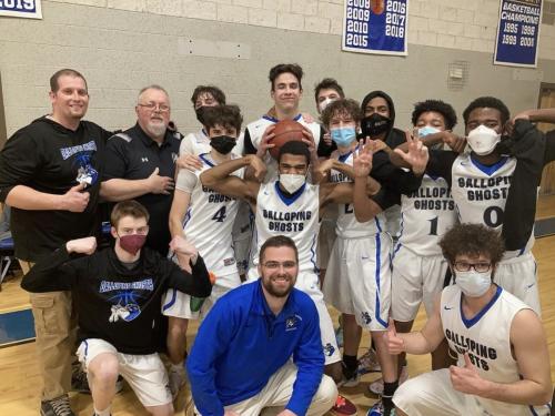 Galloping Ghosts boys basketball team in a group photo.
