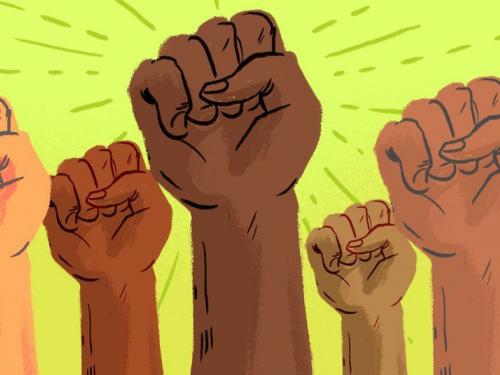 Multiracial fists in the air