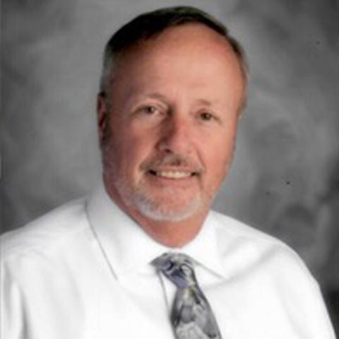 brown hair man with dress shirt and tie. 